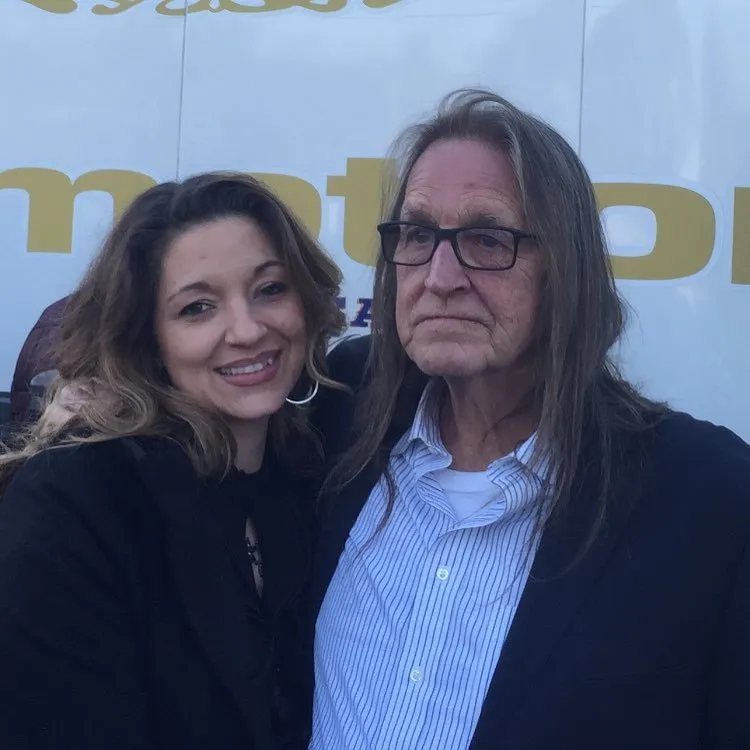 Kristina Sunshine Jung smiling beside her father George Jung at an event